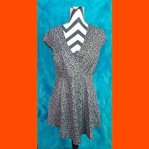 Black flow dress with small white floral detail